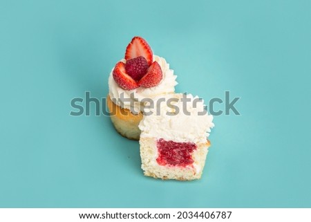 Delicious desserts cakes with berries on a blue background