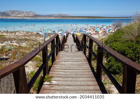 Footbridge to the beach of La Pelosa in Stintino, Sardinia, Italy Royalty-Free Stock Photo #2034411035