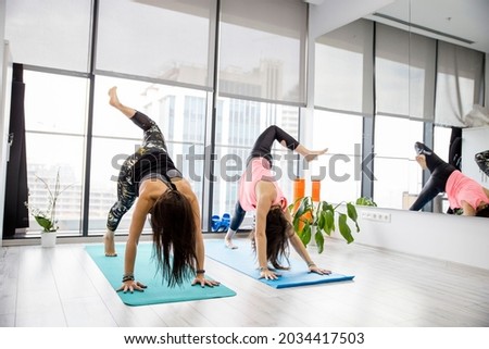 group of people exercise on yoga mat,pilates school,gym