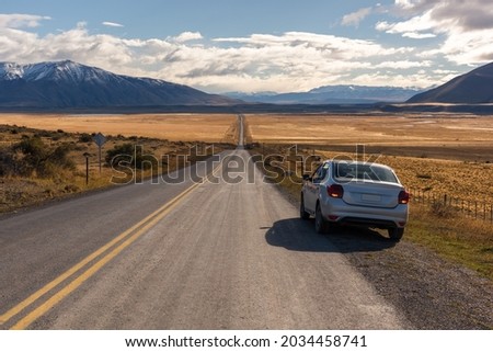 Highway theme picture. Highway concept picture. Amazing autumn. The natural landscape of the Patagonian plateau. Travel in Chile in South America.