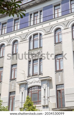 The facade of an old building from a lower perspective in the city center.