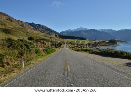 Highway Road streching to the mountains, South island, New Zealand.