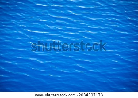 ripples on the surface of the blue ocean