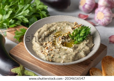 Baba ghanoush, baba ganoush or eggplant hummus, traditional Middle Eastern cuisine, selective focus Royalty-Free Stock Photo #2034616547