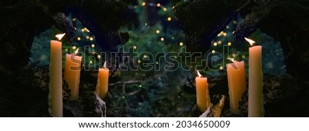 magic burning candles in fabulous Night forest Background. mysterious fairy scene. witchcraft ritual. fall season. Samhain, Halloween holiday concept. banner. copy space Royalty-Free Stock Photo #2034650009