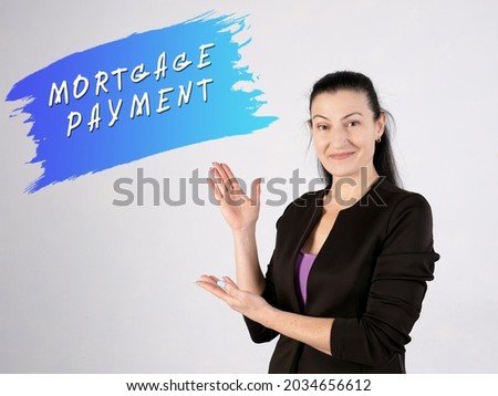 Business concept about MORTGAGE PAYMENT with phrase on the gray wall 
