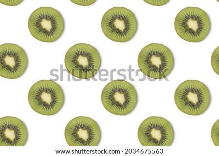 Creative seamless pattern made of kiwi, flat lay. Food concept isolated on white background