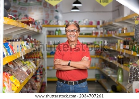 Senior man at supermarket store  Royalty-Free Stock Photo #2034707261
