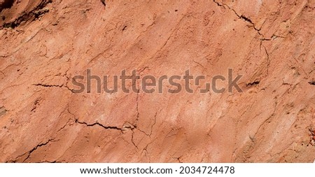 Wall of home made from mud and beautiful color from natural. Clay wall texture of House structure. Soil building for background. soft picture. Selective focus