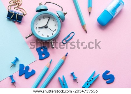 Frame of different stationery on pink background, flat lay with space for text. Back to school
