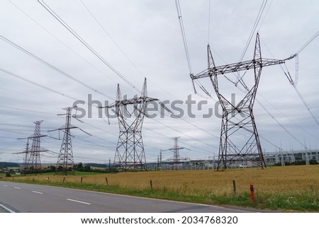 Distribution electric substation with power lines and transformers. High voltage power transformer substation.