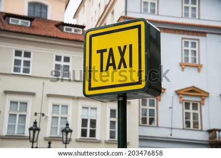Taxi sign during the daylight hours
