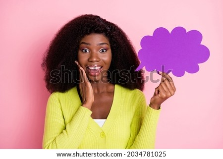 Photo of astonished dark skin girl hand on cheek open mouth hold paper cloud shape isolated on pink color background