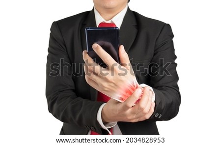 office worker holding mobile phone feels pain his wrist , wrist muscle pain