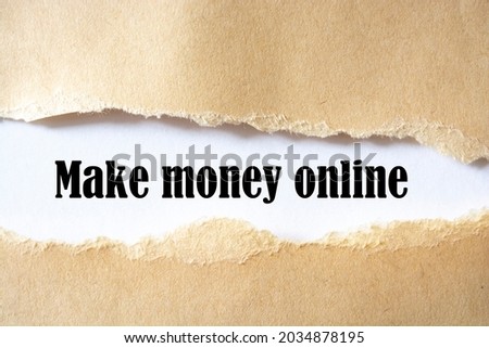 Make Money Online written under torn paper on the white background