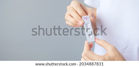 man holding Rapid Antigen Test kit with Negative result during swab COVID-19 testing. Coronavirus Self nasal or Home test, Lockdown and Home Isolation concept Royalty-Free Stock Photo #2034887831