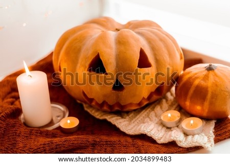 Orange Pumpkin for Halloween. Candles. Autumn Holidays