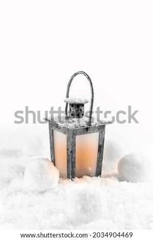 Christmas candlestick in the snow. Card. New Year and Christmas concept. Photo