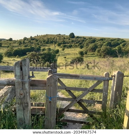 Wooden gate into Warden Hills nature reserve in Luton, Bedfordshire, England. Nature landscape. 