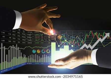 Business man manipulate stock index data arrow up growth indicators with candlesticks graph and chart symbol for investment presentation and report background.
 Royalty-Free Stock Photo #2034971165