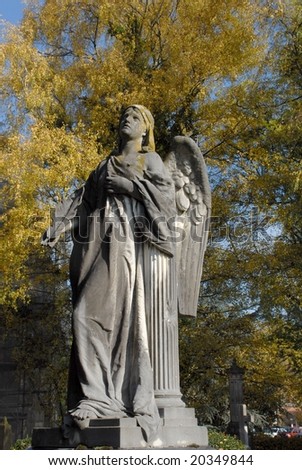 stone angel statue in Autumn