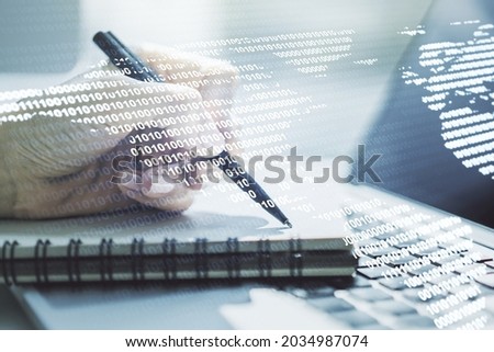 Double exposure of digital America map and hand writing in notebook on background with laptop, research and strategy concept