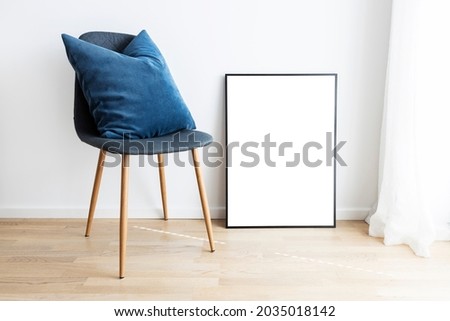 Modern interior with mockup frame and chair.