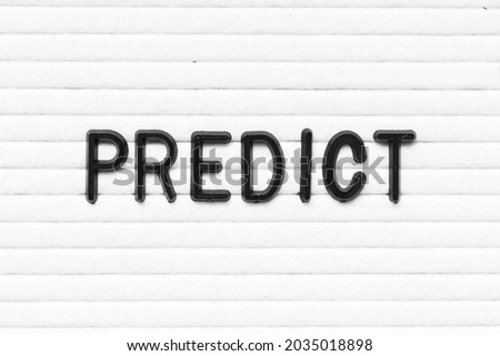 Black letter in word predict on white felt board background