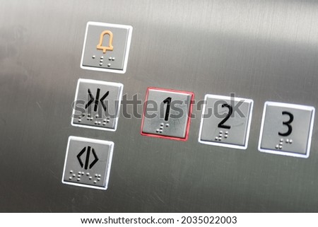 Level switch button of elevator during it going down to 1st floor. Transportation sign - symbol object, close-up and selective focus.