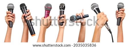 Set of woman hands holding microphones isolated on white background. Royalty-Free Stock Photo #2035035836