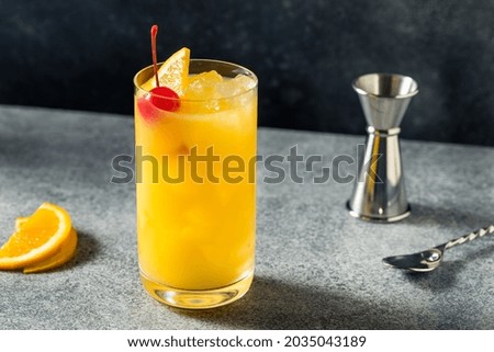 Boozy Refreshing Vodka Harvey Wallbanger Cocktail with Orange Juice Royalty-Free Stock Photo #2035043189