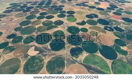 Aerial view of center pivot irrigation landmarks an agricultural technique also called water wheel 4k screenshot of high resolution animation