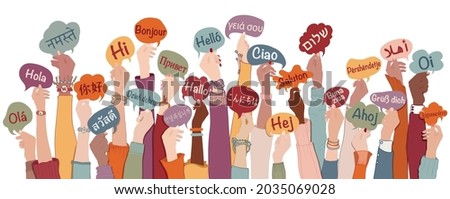 Many arms raised of diverse and multi-ethnic people holding speech bubbles with text -hallo- in various international languages. Diversity people.Racial equality.Sharing and collaboration Royalty-Free Stock Photo #2035069028