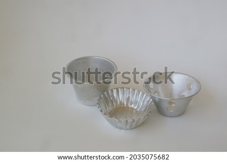 metal baking cup on white isolated background photo