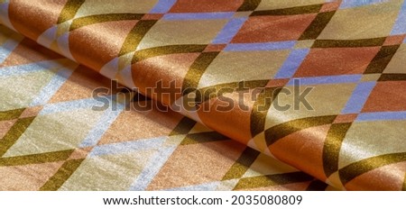 silk fabric with geometric square shapes in brown, yellow and white. Abstract background, blank template. Simple geometric pattern, wallpaper, texture, background.