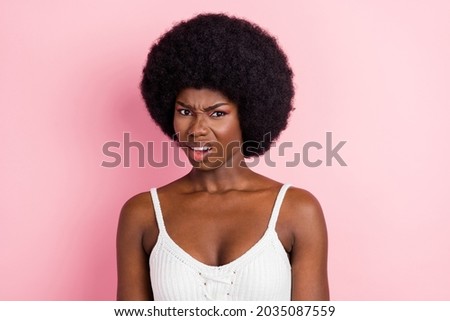 Photo of sad millennial curly hairdo lady dislike wear white top isolated on pastel pink color background