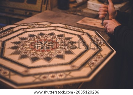 Beautiful decoration of traditional marquetry (thalassaea) - Alhambra Palace in Granada, Spain World Heritage Site Royalty-Free Stock Photo #2035120286