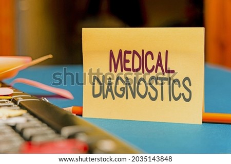 Conceptual caption Medical Diagnostics. Word Written on a symptom or characteristic of value in diagnosis Multiple Assorted Collection Office Stationery Photo Placed Over Table