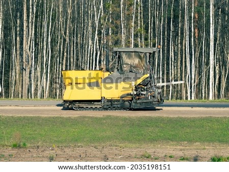 highway construction. Road milling machine and tamping machine Royalty-Free Stock Photo #2035198151