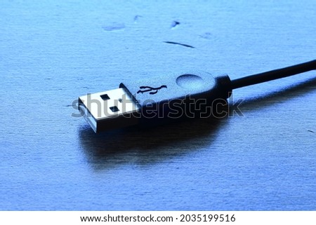 USB plug on wood table top