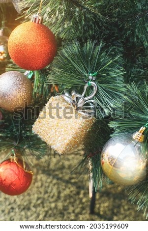 Gift box and sparkling ball on the tree Christmas home decoration