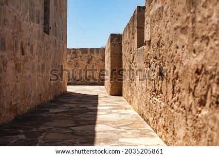 ancient walls of yellow stone, exit and entrance, corridor, history