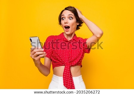 Photo of astonished attractive girl hand on head open mouth unexpected post isolated on yellow color background