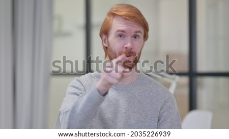 Young Beard Redhead Man Pointing and Inviting