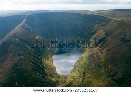 Aerial view of Coumshingaun Lough. Irish lake in County Waterford. Set in a mountain circus, in the Comeragh Mountains, it is one of the most beautiful lakes in all of Ireland.