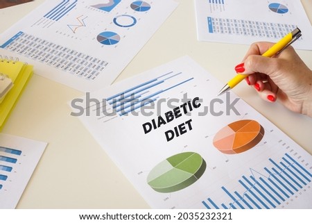 Business concept about DIABETIC DIET with sign on the financial document. 
