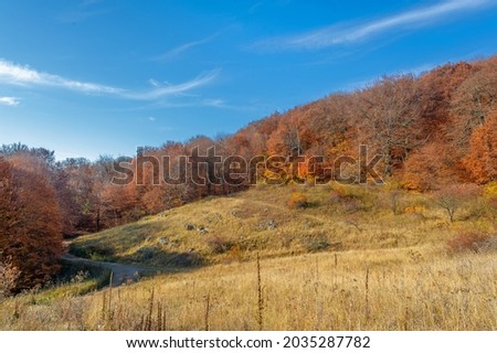 Autumn photos of the Crimean peninsula, Mount Demerdzhi, the famous Crimean landmark. This place is interesting for unusual extracts that give rise to the forces of nature: wind rains and earthquakes