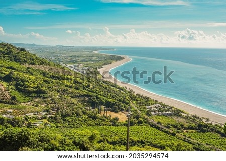 Landscape View Of The Beautiful Eastern Coastline With Blue Sky And Water Tower Reflection From Huayuan Observation Deck, Taimali, Taitung Royalty-Free Stock Photo #2035294574