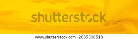 yellow silk fabric with painted meadow flowers, floral background. Many pale flowers in a colorful composition. Background texture