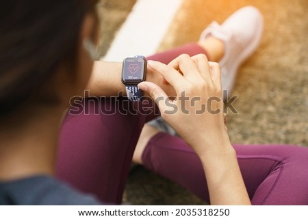 close-up sport women check on her smart watch Royalty-Free Stock Photo #2035318250
